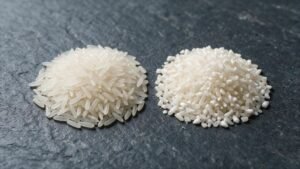 Two piles of white rice comparing 5 percent broken and 25 percent broken grades