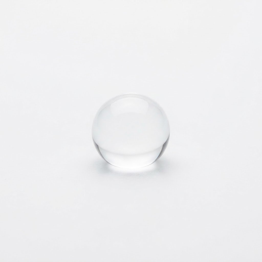 A single water droplet representing the moisture limit on D-98 basmati rice