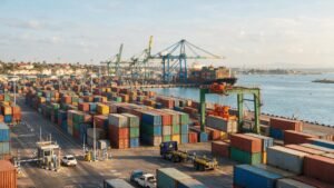 Shipping containers and gantry crane at Mombasa port handling rice imports into Kenya