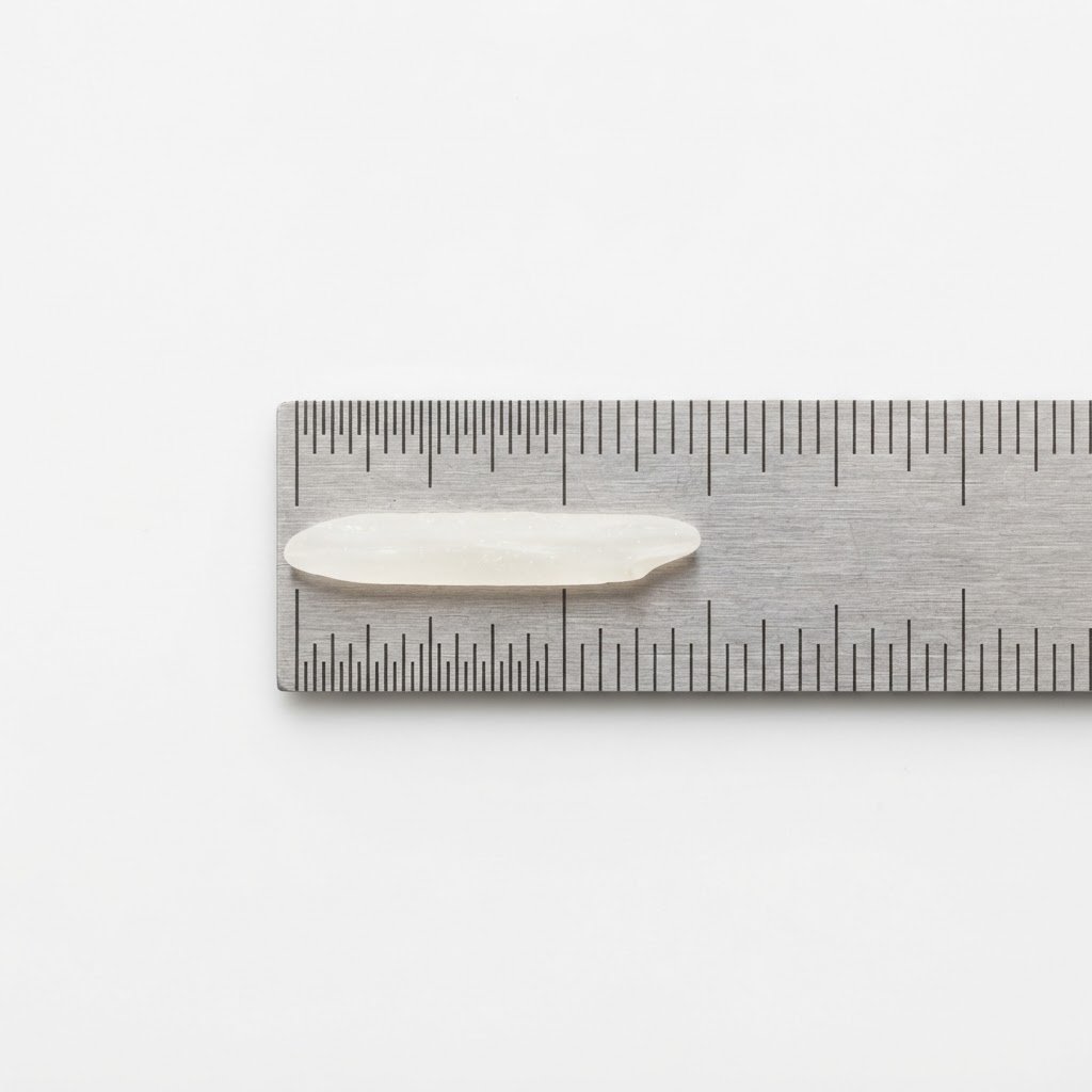 A single Super Kernel basmati grain measured against a ruler at 7.20mm